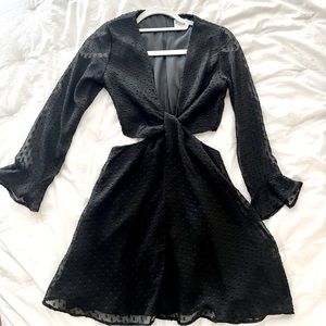 Black mini dress with cutout details. Long sleeve - fun for a night out!